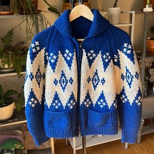 Hand knit sweater with design.
